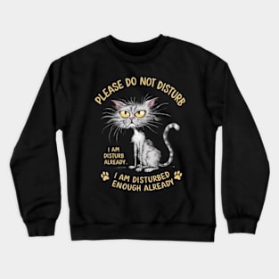 A whimsical cartoon drawing of a disheveled cat, with its fur sticking out in all directions and large yellow eyes showing irritation. (12) Crewneck Sweatshirt